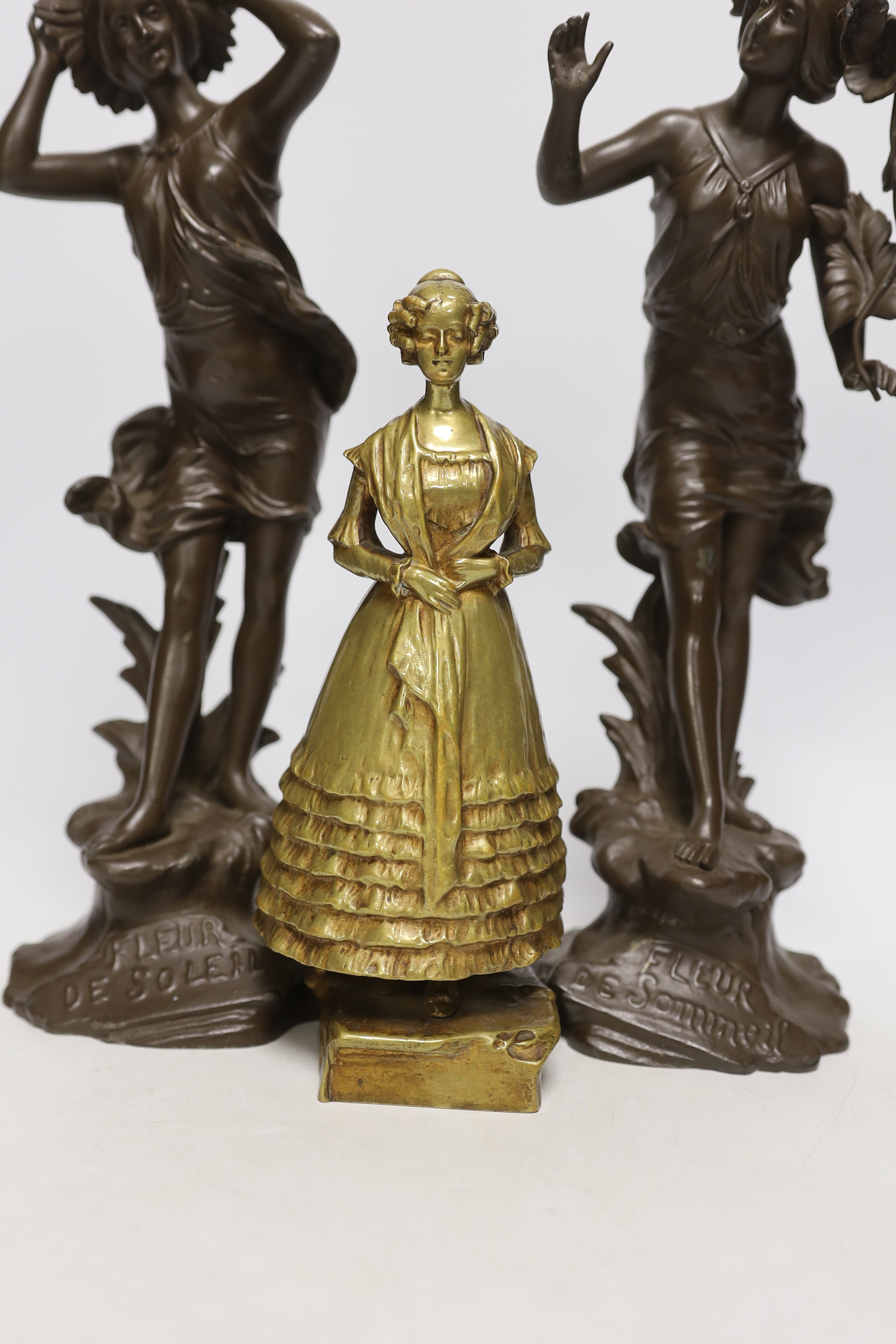 After Arthur Rubinstein, bronze study of a lady and a pair of French spelter figurines, largest 33cm high